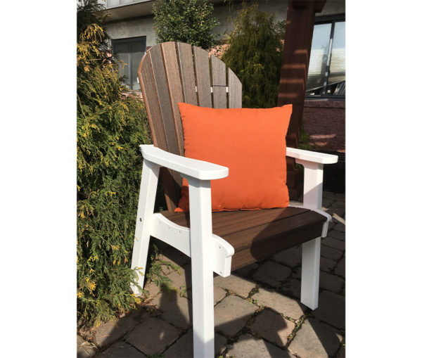 Twenty two inch pillow displayed on an Adirondack chair.